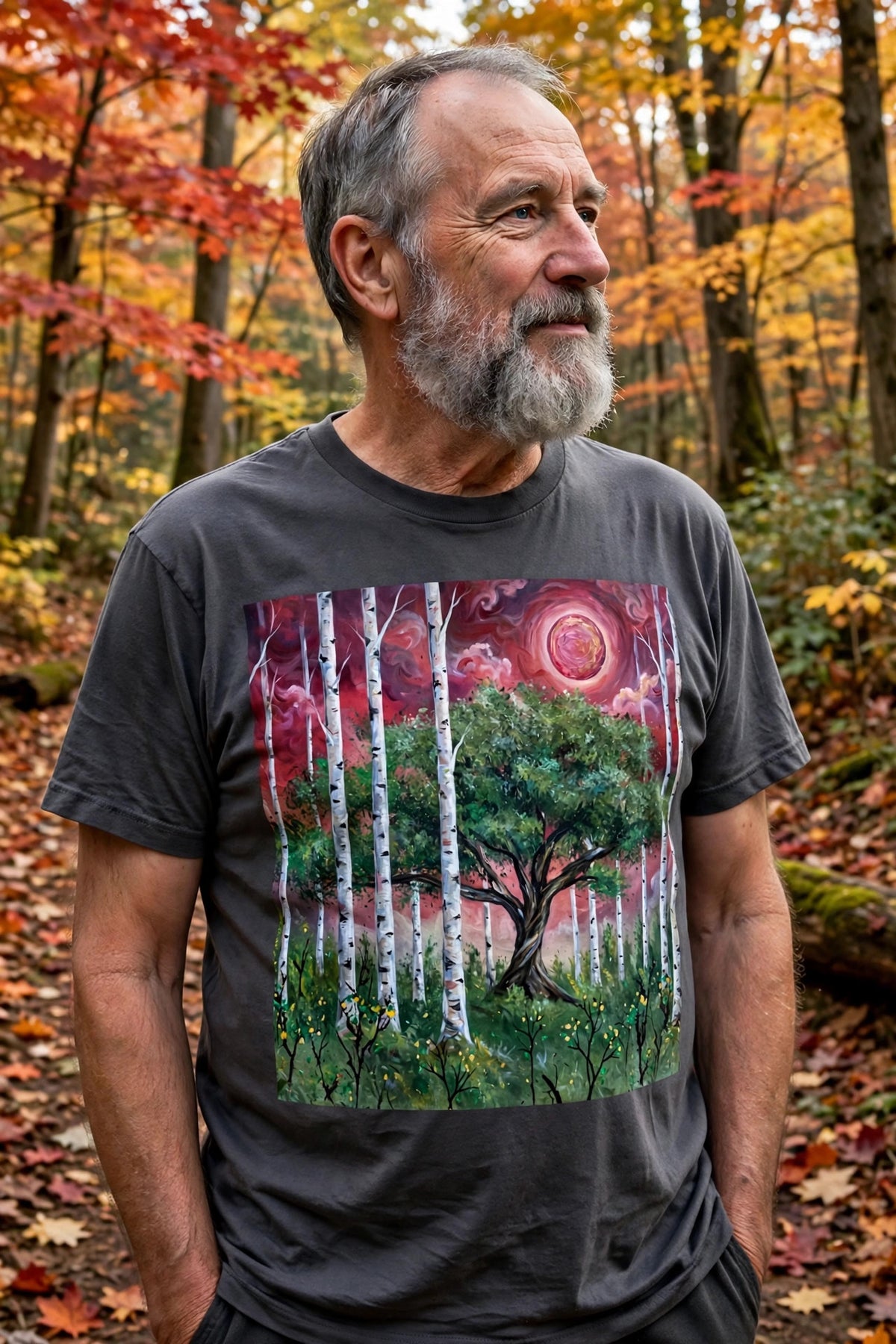 Older man wearing the Crimson Grove art print t-shirt in an autumn forest